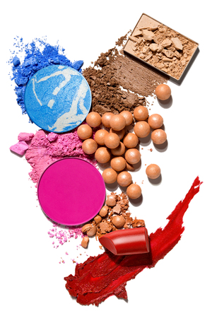 Creative concept photo of cosmetics swatches beauty products lipstick blusher balls pearls square and round eyeshadow on white background.の写真素材