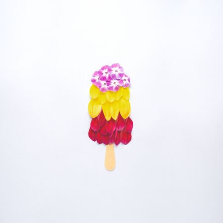 Creative concept still life nature green photo of flowers in bloom in shape of ice cream   on grey background.の写真素材
