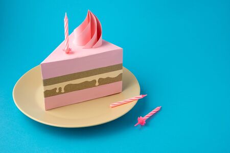Creative food health diet concept holiday photo of birthday cake with candles on plate on blue...