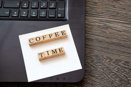 view from the top on the inscription coffee time, the concept of a break for rest. High quality...