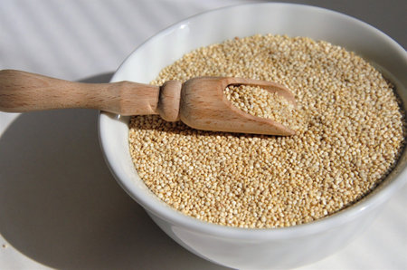 Quinoa seed for healthy eating in a white plate with a spoon. High quality photoの写真素材