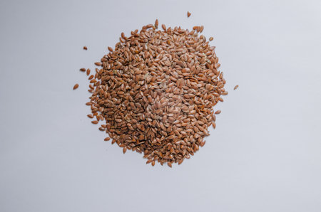 brown flax seeds on a light background. High quality photo