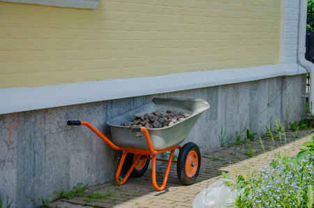 gravel trolley for pouring a path or lawn, working trolley on wheels for transporting material on...