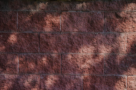 Red brick background with sun glare. High quality photo