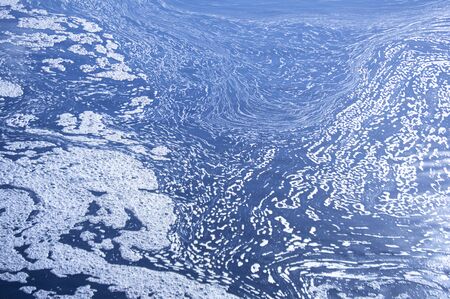 Blue river water patterns with white foam background picture stock photography