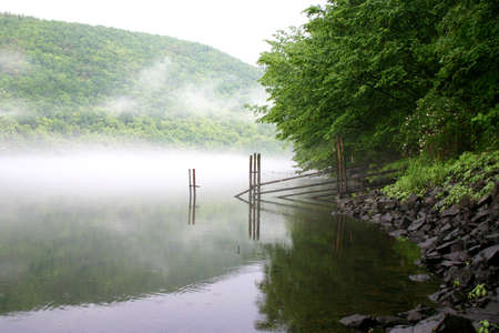 fog over the riverの写真素材
