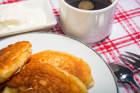 A light breakfast of cheesecakes with a cup of coffeeの写真素材