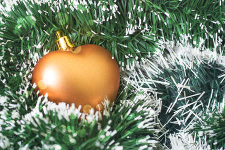 Christmas toys golden color in tinselの写真素材