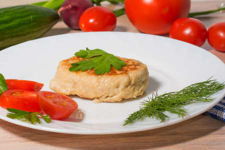 Light dinner of vegetables and steak on white plate