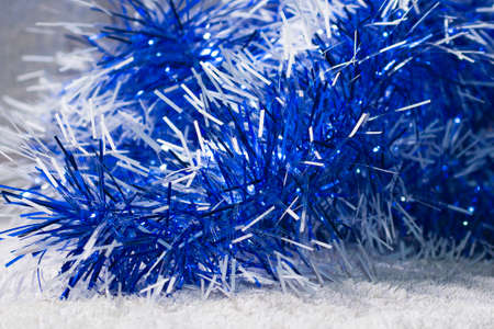 Blue tinsel on winter surface. Christmas themeの写真素材