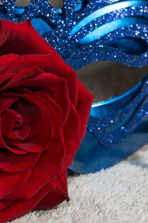 Blue carnaval mask with red roseの写真素材