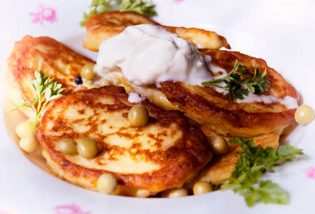 useful fritters with sour cream for Breakfastの写真素材