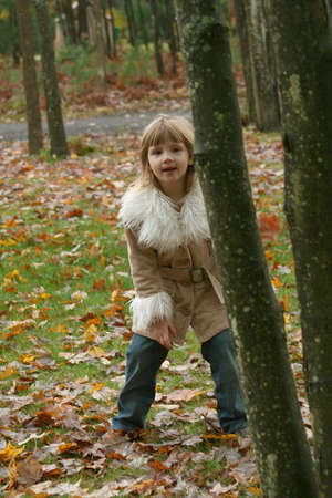 Little girl outdoors in autumnの写真素材