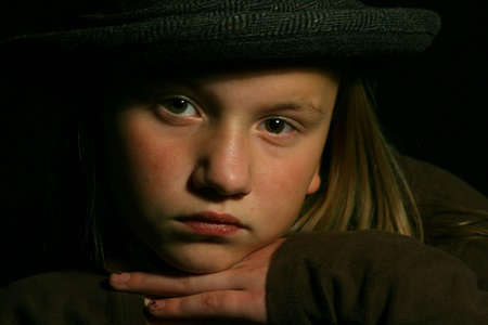 Beautiful young girl isolated on black close upの写真素材