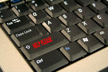 Abstract of laptop computer with Help Please keyの写真素材