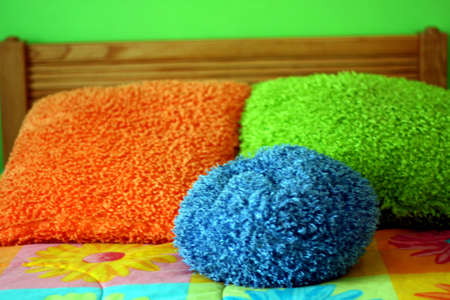 Little girls colorful bed and pillowsの写真素材
