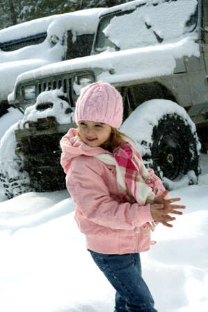 Little girl outdoors in front of off road recreational vehicleの写真素材