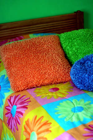 Little girls colorul bed and pillowsの写真素材