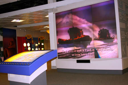 Large Television screen in airport terminalの写真素材