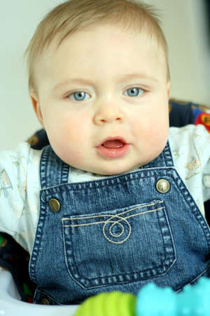 Sweet baby boy with blue eyesの写真素材