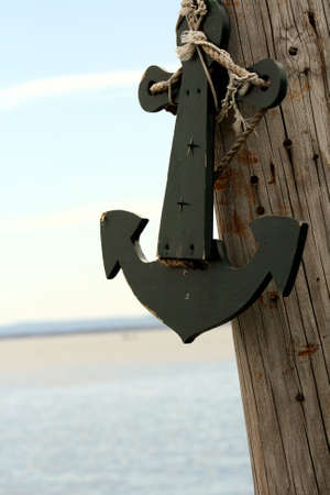 Anchor on pole near lakeの写真素材