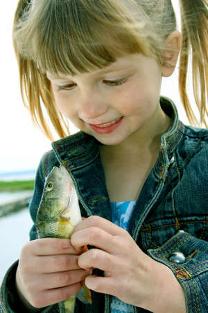 Little Girl With Fish 2の写真素材