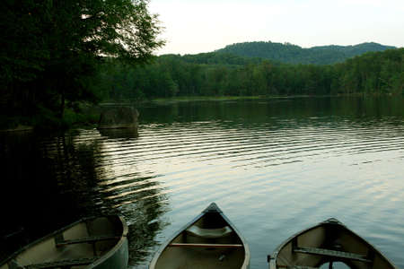 Stock image of three row boats on shore of Lake Sereneの写真素材