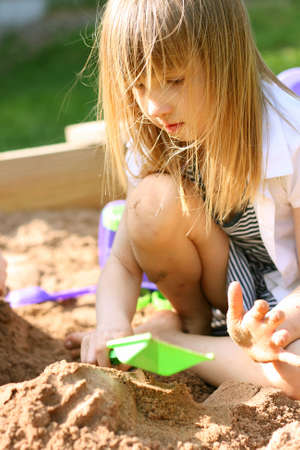 Little girl in sand boxの写真素材