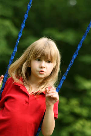 Little girl on swingsetの写真素材