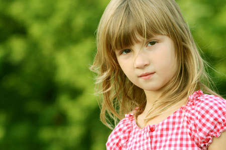 Expressive little girl outdoorsの写真素材