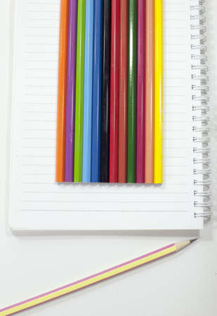  pencil and agenda on a notebook の写真素材