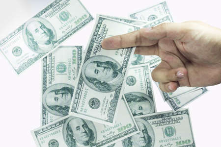 hand with pack of one hundred dollars