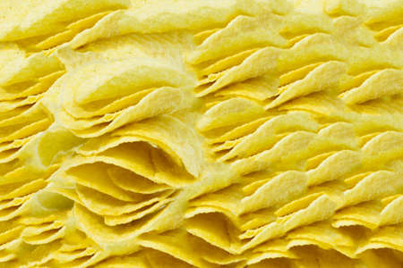 Stack of potato chips on a white の写真素材