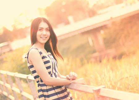 Fashion  of a  autumn girl  wearing a striped Thailand.の写真素材