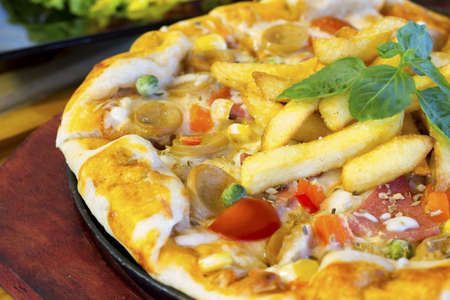 Fresh pizza with oven roasted tomatoes, peppers, の写真素材