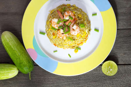 Fried rice with shrimp on the wood tableの写真素材