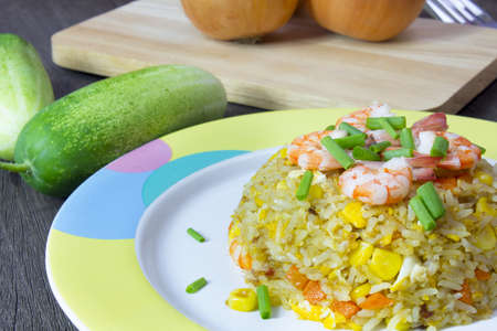 Fried rice with shrimp on the wood tableの写真素材