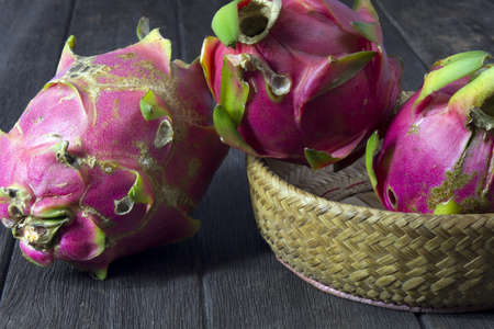 Dragon fruit on wooden floorsの写真素材