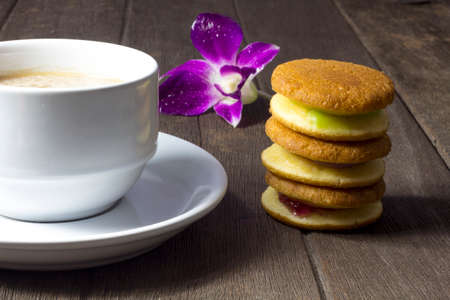 Coffee and sweets to tasty on a wooden floorの写真素材