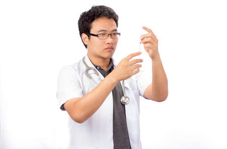  doctor preparing a syringe on a white backgroundの写真素材