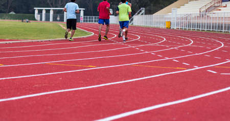 man ready to start running on running track