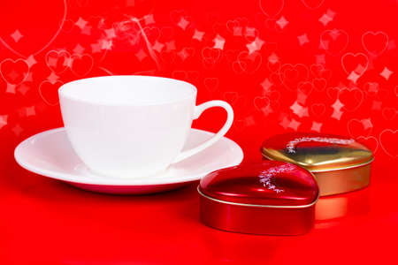 Coffee cup with heart shape chocolate の写真素材