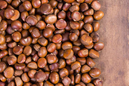 Chestnuts on an old boardの写真素材