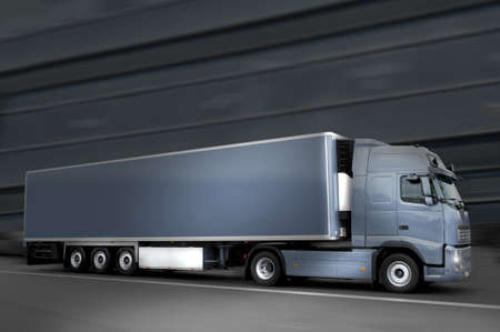 blue semi truck in the night