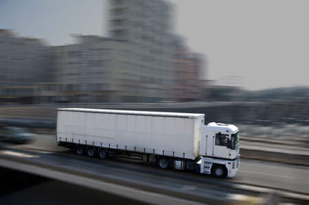 white semi-truck in townの写真素材
