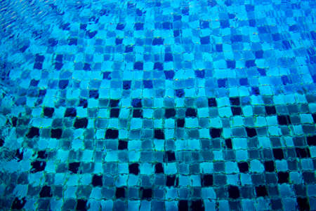 blue swimming pool tiles and stairの写真素材