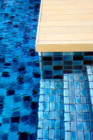 blue swimming pool tiles and stair