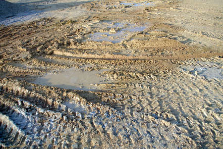 sunlight construction soil with tractor wheel trace 