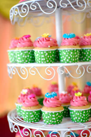 cute and colorful yummy cupcakes tierの写真素材
