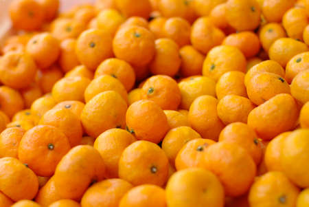 pile of fresh oranges backgroundの写真素材